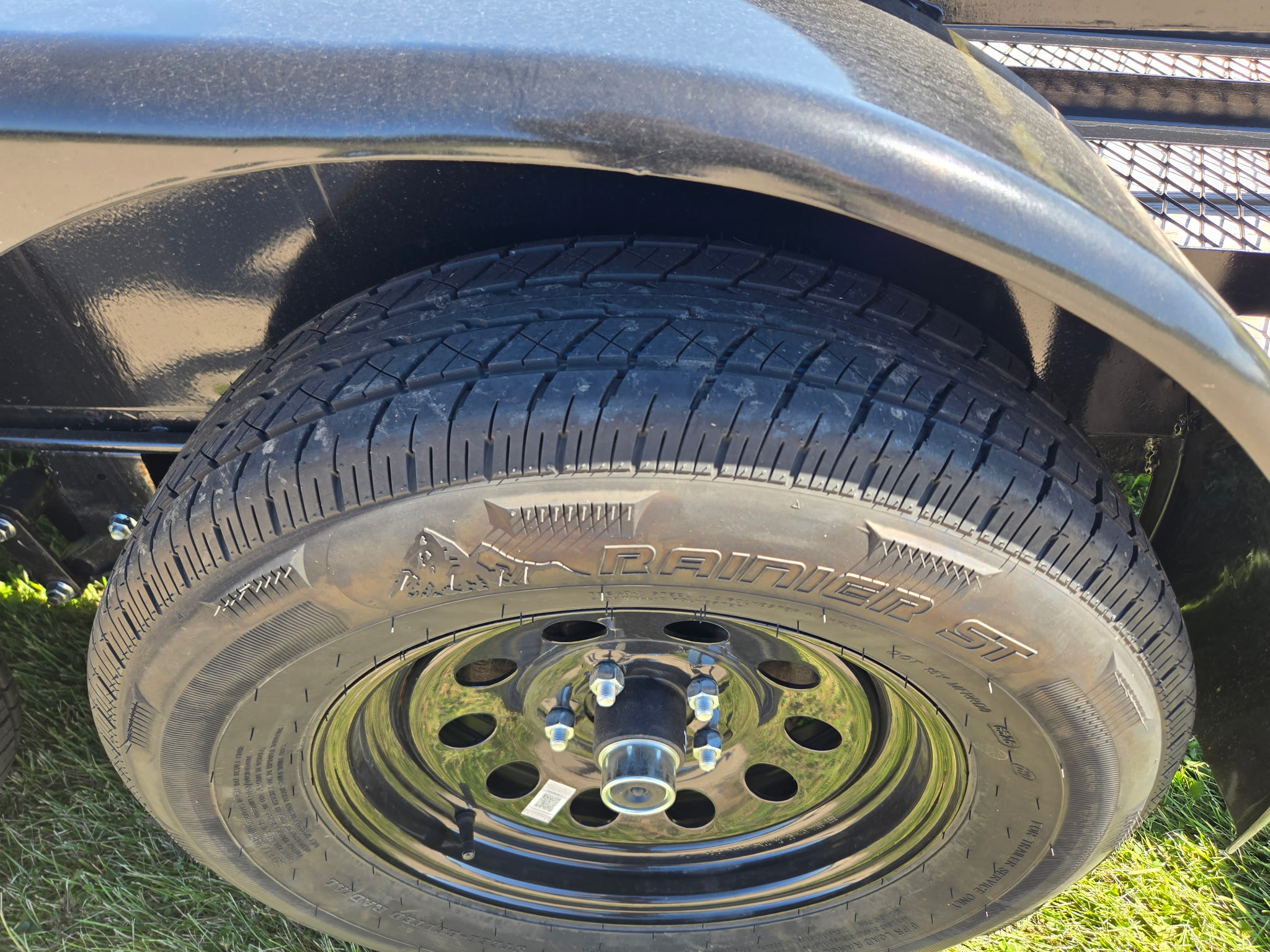 Rainier ST trailer tire on a black steel wheel
